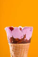 strawberry and chocolate ice cream cone