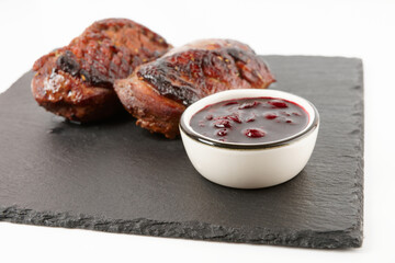 Two roasted duck fillets with cherry sauce