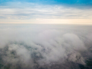 Obraz premium High flight above the clouds in Kiev. Spring cloudy morning. Aerial high view.