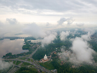 High view of the Dnieper River in Kiev through the clouds. Spring cloudy morning. Aerial high view.