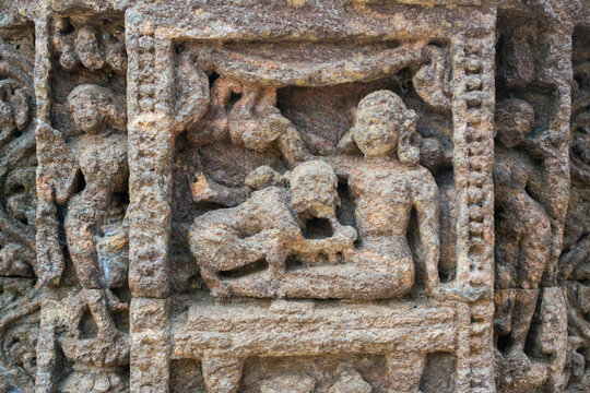 Close up of Kamasutra scenes on the wall of Konark sun temple, Odisha 