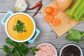 Vegetable puree soup and ingredients top view