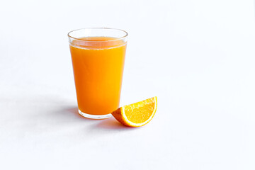 Orange juice and oranges on white background.