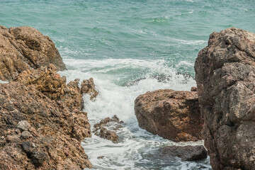 Waves crashing on the rocks.