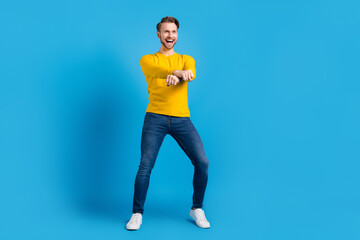 Fototapeta na wymiar Full length body size photo of smiling man cheerful crazy dancing on weekend isolated vivid blue color background