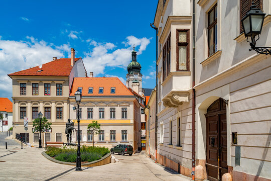 Cozy little baroque square in the center of Gyor, with the bronze sculpture of Nimrod, in the background the Cathedral tower