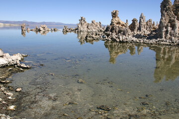 Mono Lake, California, Tufa Formations with reflections and Mountains in the Background