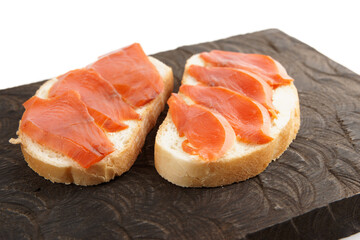 Two open-face sandwiches with smoked salmon