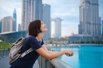 Fototapeta na wymiar Young beautiful woman enjoying the view of Dubai downtown.