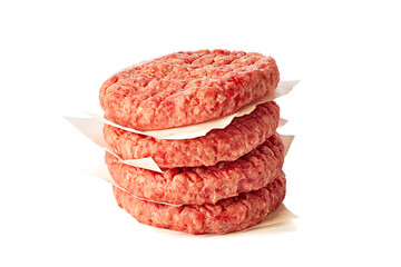 Stack of raw burger patties on white background