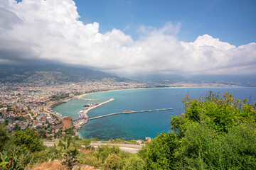 Fototapeta na wymiar The scenic view of Red Tower and Alanya Marina from Alanya Castle.