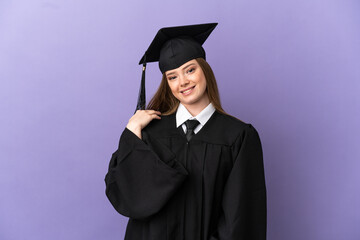 Young university graduate over isolated purple background laughing