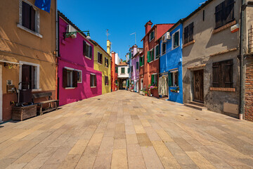 Beautiful multi colored houses in Burano island in a sunny spring day. Venice lagoon, UNESCO world heritage site, Veneto, Italy, southern Europe.