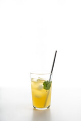 glass of citrus lemonade with ice and mint