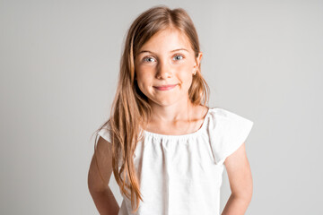 stylish little girl portrait in the studio grey background