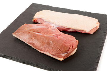 Two duck fillets on black slate plate