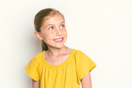 stylish little girl portrait in the studio white background