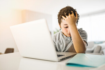 bored and sad teen student after hard work with computer - Powered by Adobe