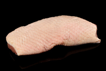 Duck fillet shot on black surface