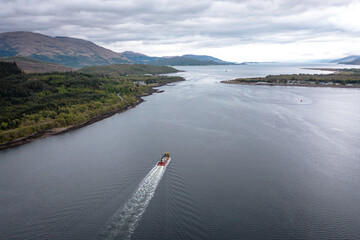 A Transporter Ship Motoring Next to the Coast