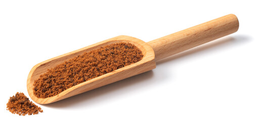 brown granulated sugar in the wooden scoop, isolated on pure white background