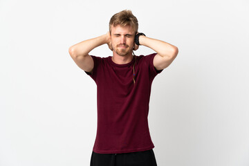 Young handsome man isolated on white background frustrated and covering ears
