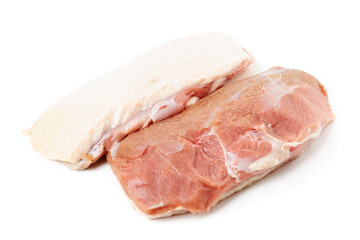 Two raw duck breast fillets on white surface