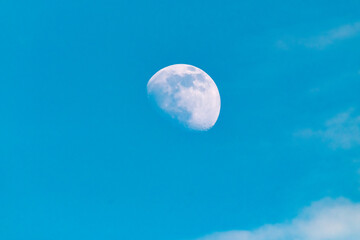Moon on the blue sky during the day in Ireland