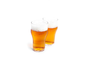 A glasses of light beer isolated on a white background. Light beer.
