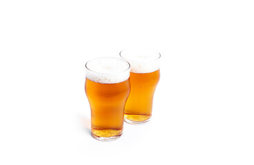 A glasses of light beer isolated on a white background. Light beer.