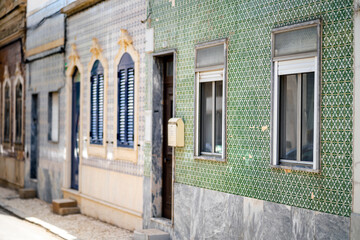 Beautiful houses cover with traditional tiles called azulejo, Olhao, Portugal