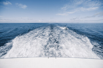 View from the boat stern of the wake (wash) effect on the water from the motor placed on the...