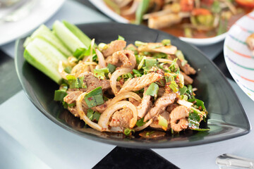 Larb Moo Nam Tok or Grilled Pork Slices Salad or Beef.It is a hundred food for Thai people and Isan people.