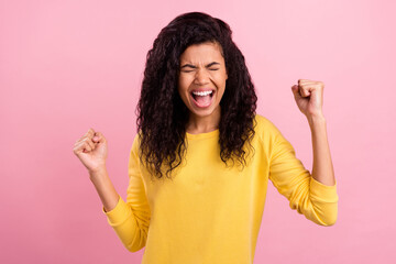 Photo of young excited black girl happy positive smile rejoice victory lucky success fists hands isolated over pink color background