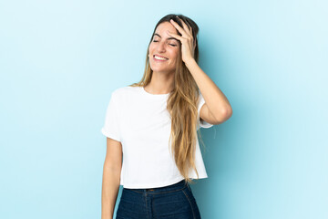 Young caucasian woman over isolated background smiling a lot