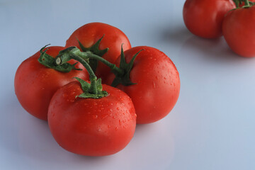 natural fresh tomato on a white background