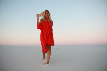 beautiful tanned girl on a white sandy beach by the ocean