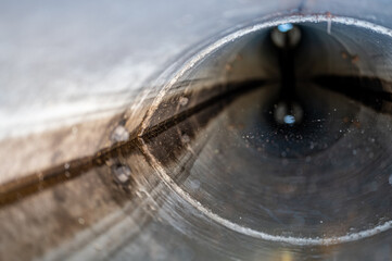 water surface level view from inside a concrete culvert