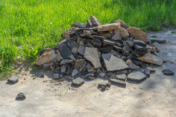 pieces of dismantled asphalt piled up in a heap