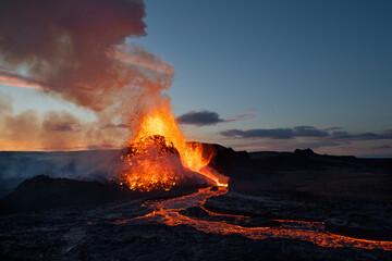 Reykjanes Peninsula, Iceland - May 9th 2021: Geldingadalir eruption at dusk with a large magma explosion. 
