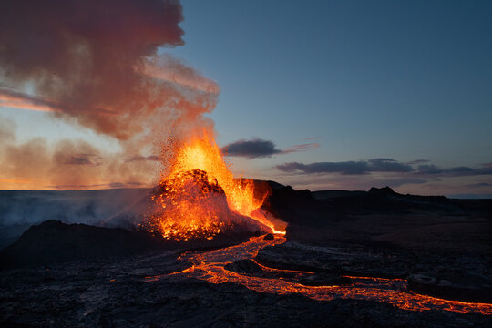 Reykjanes Peninsula, Iceland - May 9th 2021: Geldingadalir eruption at dusk with a large magma explosion. 