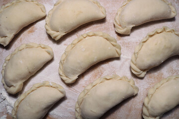 National dish dumplings on a wooden surface.