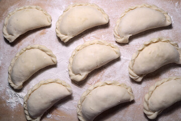 National dish dumplings on a wooden surface.
