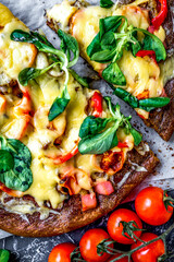 cooking pizza with vegetables and cheese on stone desk background top view