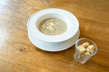Top view of mixed mushroom soup with Biscuits.