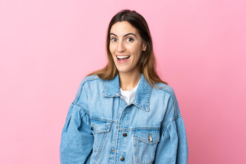 Fototapeta premium Young caucasian woman isolated on pink background with surprise facial expression