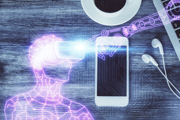 Double exposure of drawing man in AR glasses over table with phone. Top view. VR concept.