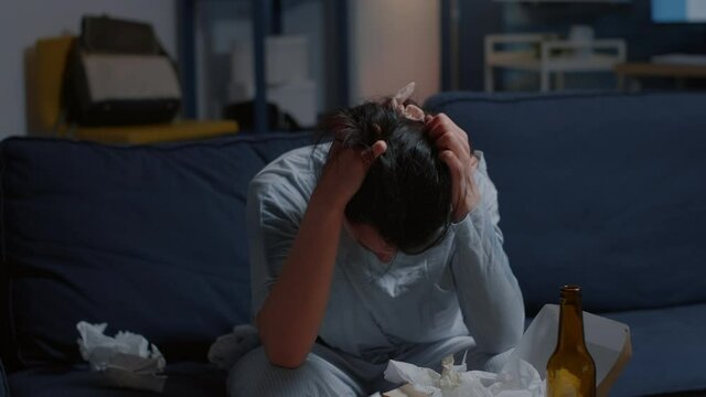 Traumatized unhappy lonely depressed woman putting hands on head felling vulnerable hopeless disappointed frustration suffering from break up mental problems, suicidal thoughts, chronic disease