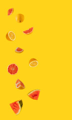fresh lemon, watermelon and grapefruit on the illuminating yellow background. tropical summer abstract art. minimal flat lay