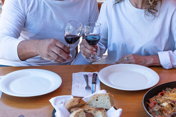 Preparation of typical Spanish food paella with chicken meat pork rice and vegetables